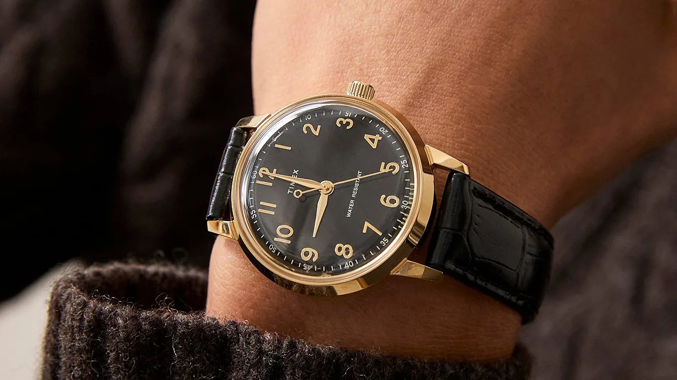a todd snyder x timex watch on a mans wrist