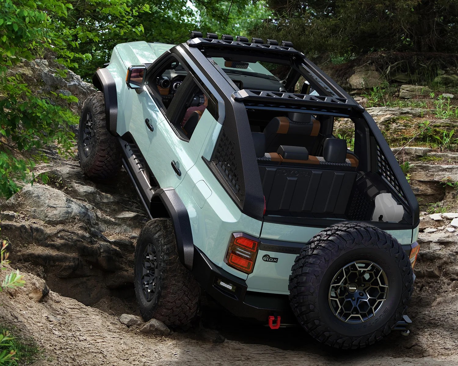 the toyota land cruiser rox concept suv climbs a hill in the forest