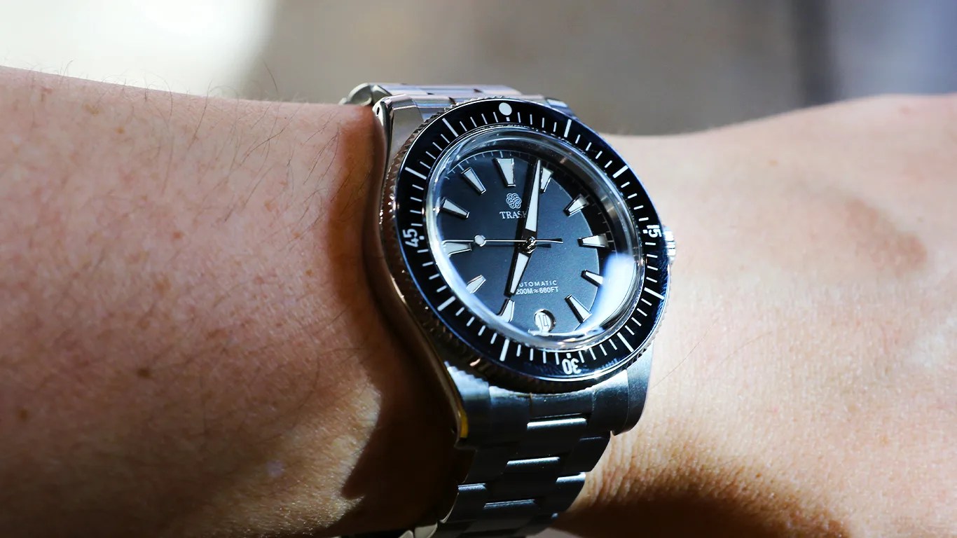 an affordable traska dive watch on a mans wrist