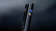 Big Idea Design bolt-action pen on black blurry background