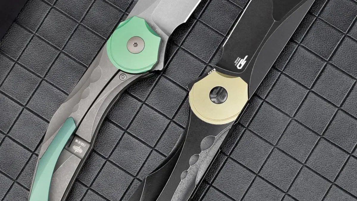 Closeup of Bestech Excentric knives open on gridded counter