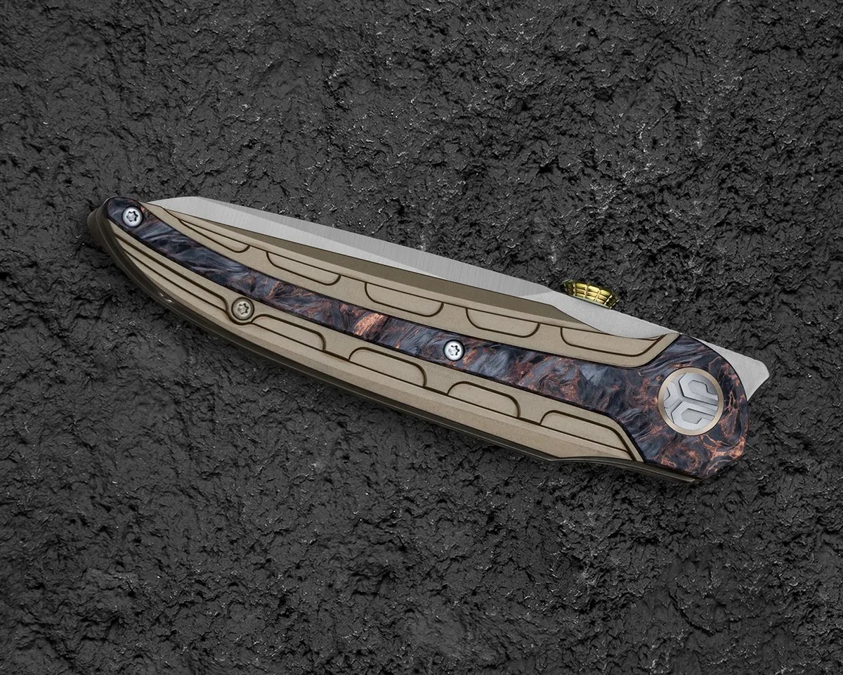 Closed Bestech Prydwen knife on black rock background