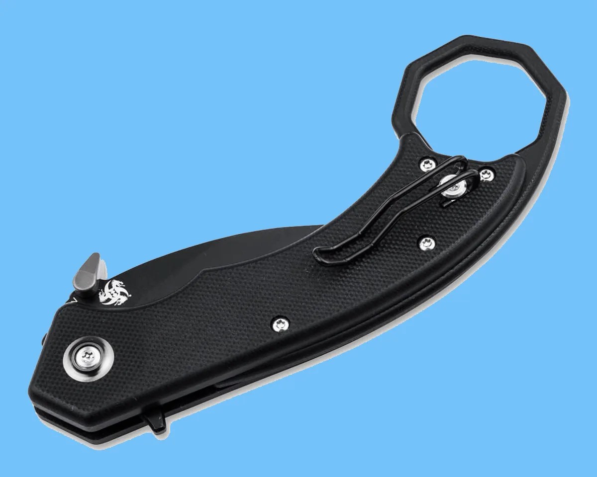Closed Böker Hel Karambit on blue background