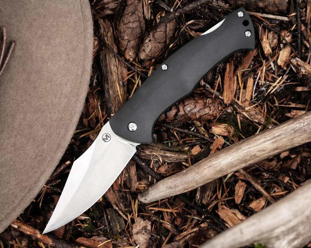 Boker Magnum Echidna knife laying on forest floor