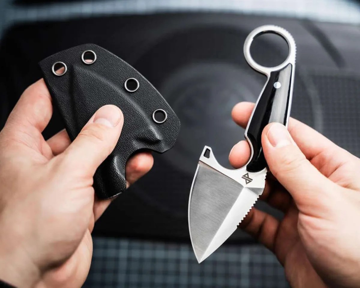 Böker Magnum Enki and kydex sheath held in two hands