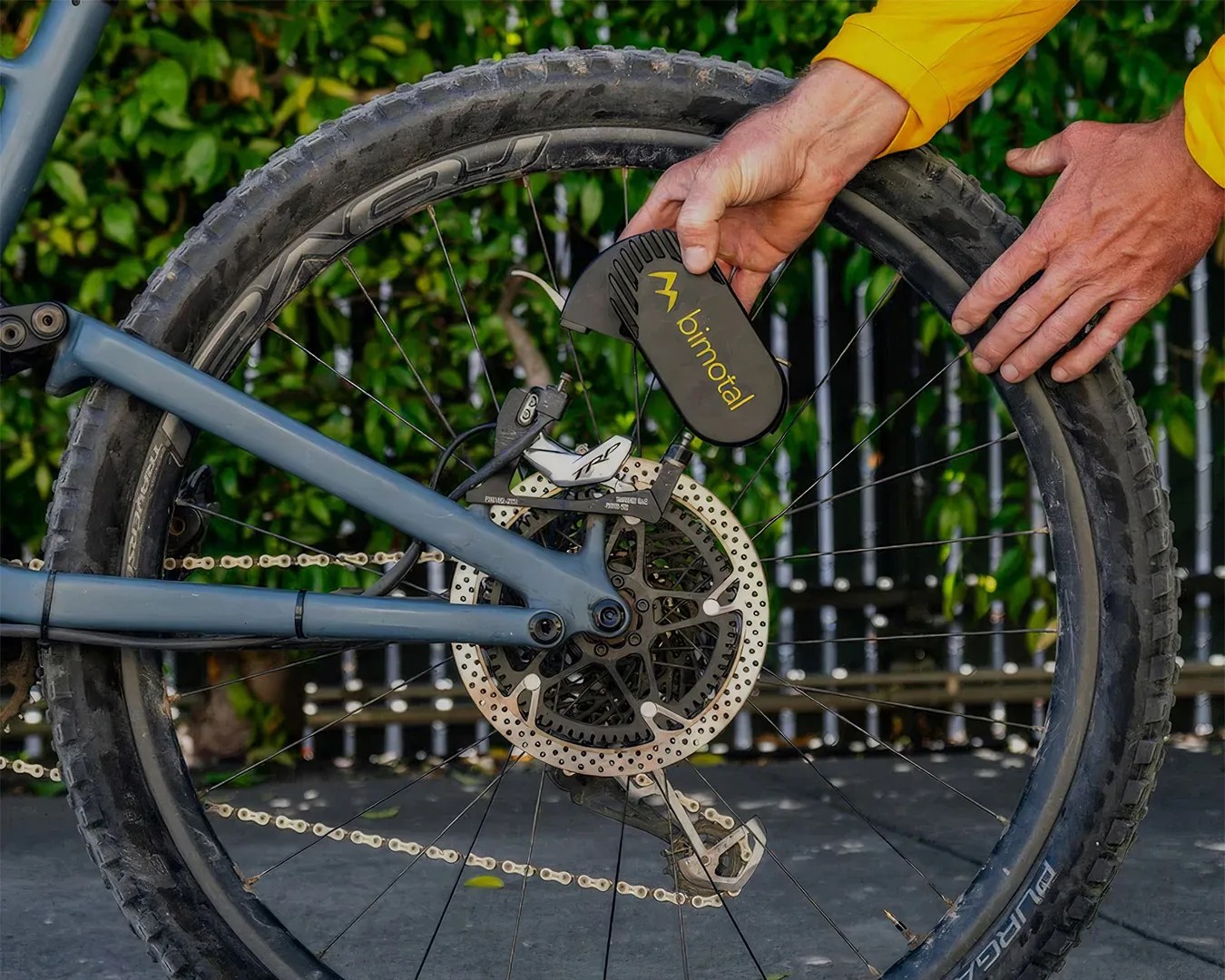 man putting Bimotal Elevate EBike Motor System on bike