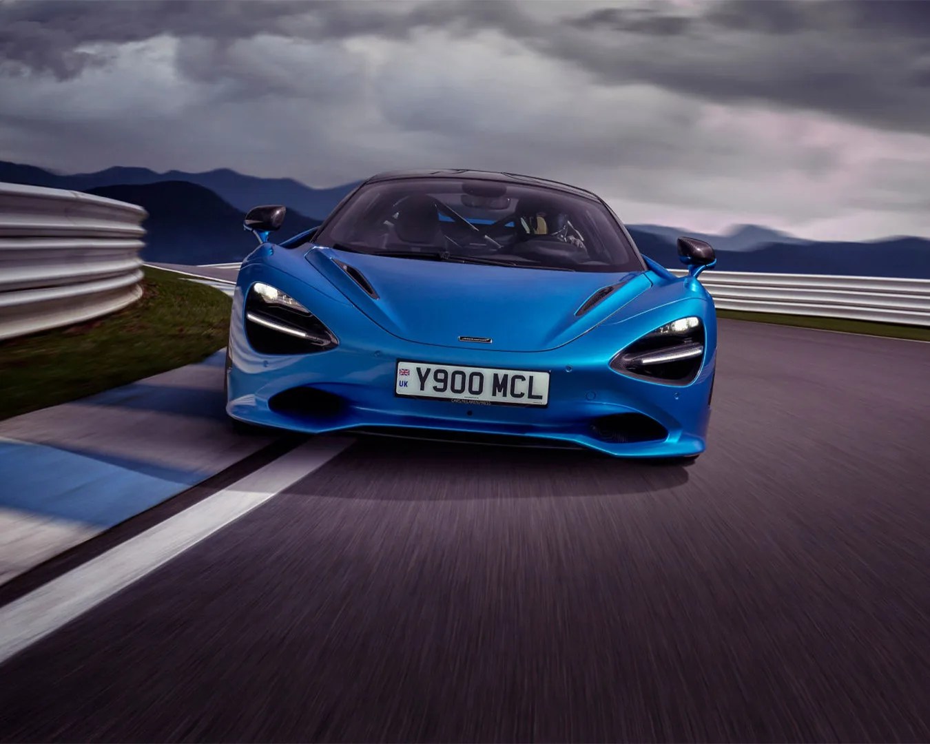 McLaren 750S sports car racing down track