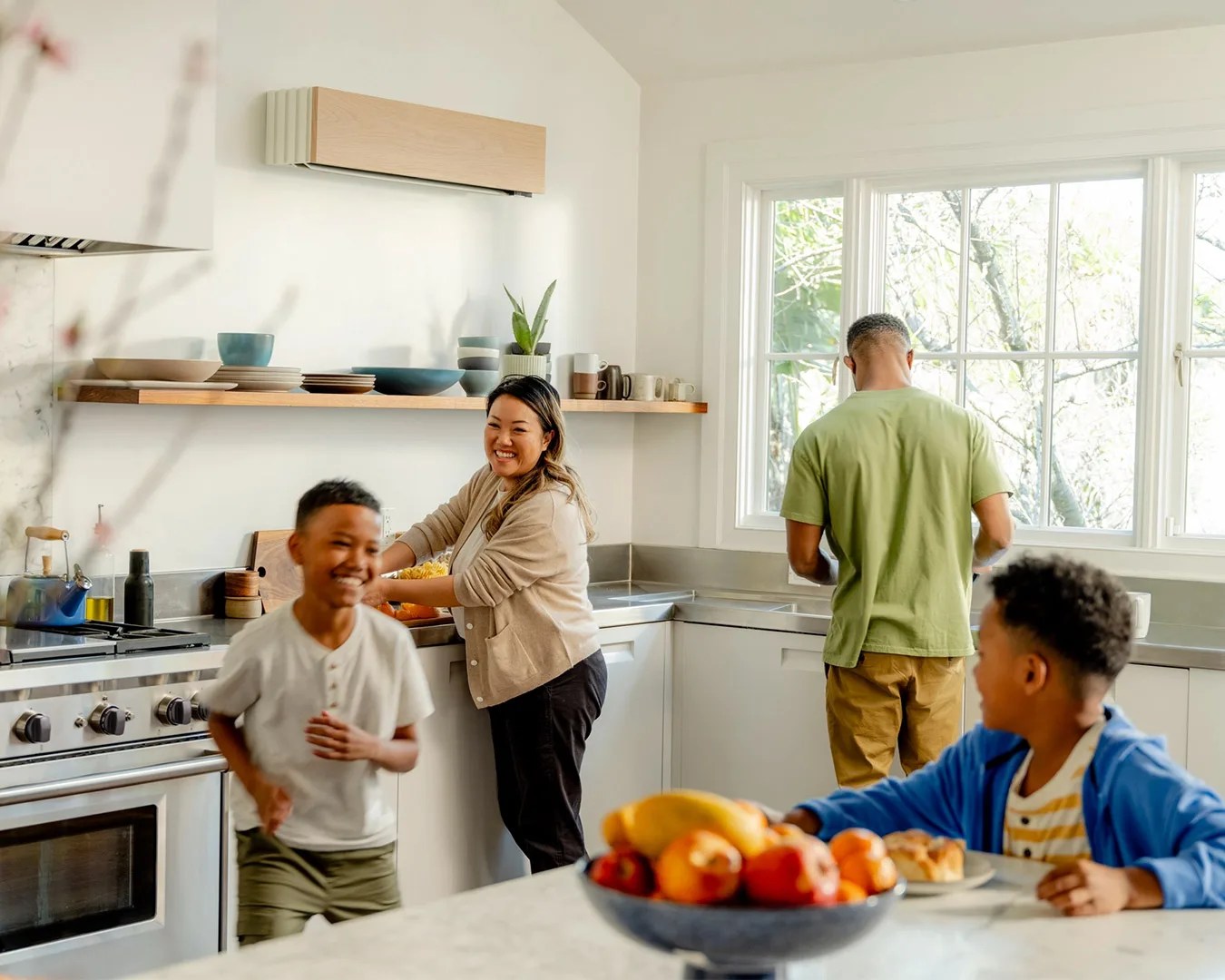 family in kitchen enjoy their quilt heat pump