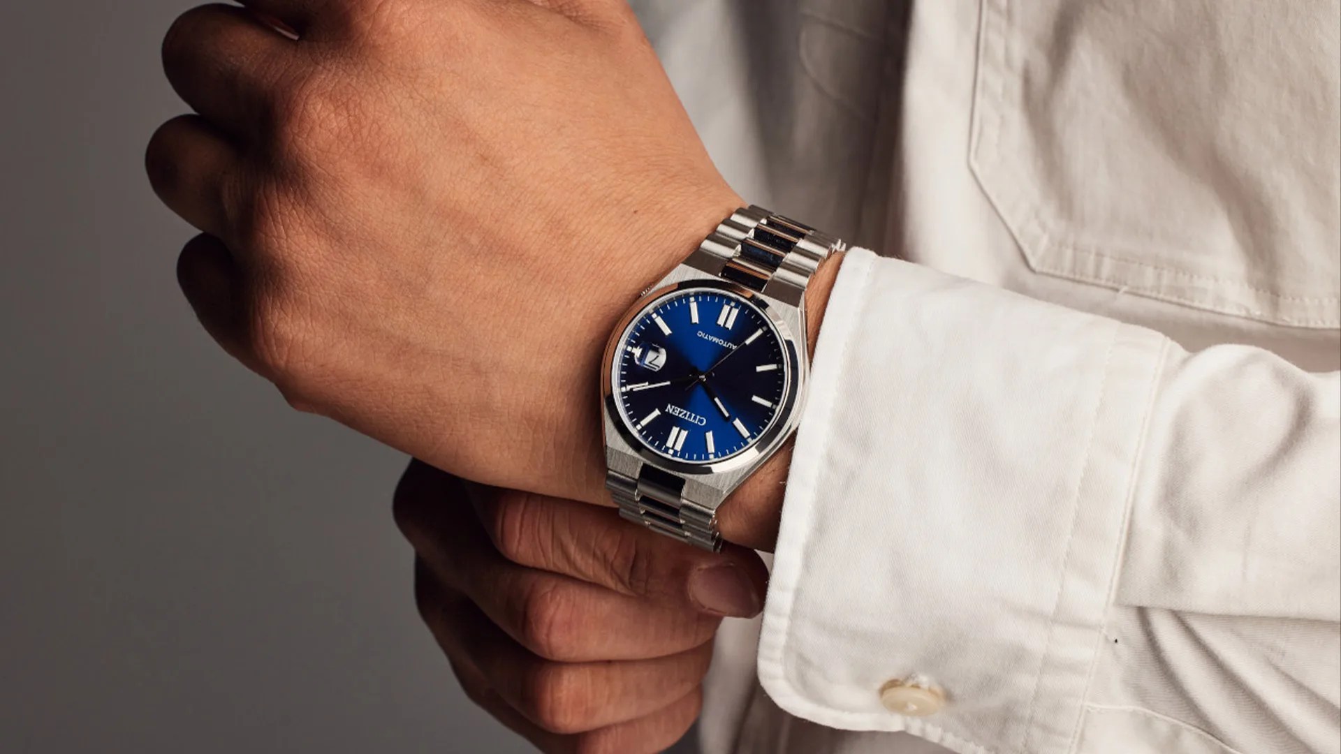 man wearing citizen watch on wrist