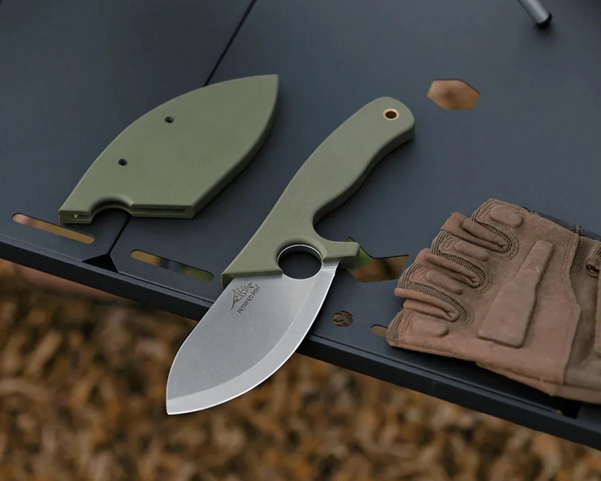 Petrified Fish PFH01 EEL knife, sheath, and fingerless tactical glove on black table