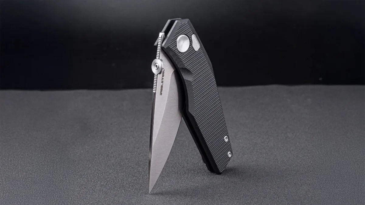 Real Steel Spectrum knife standing up on black canvas with black background