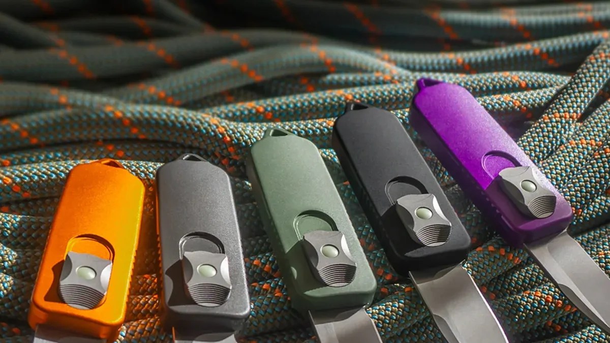 Terrain 365 x Prometheus Design Werx CAS OTF knives laying on green blue and orange ropes