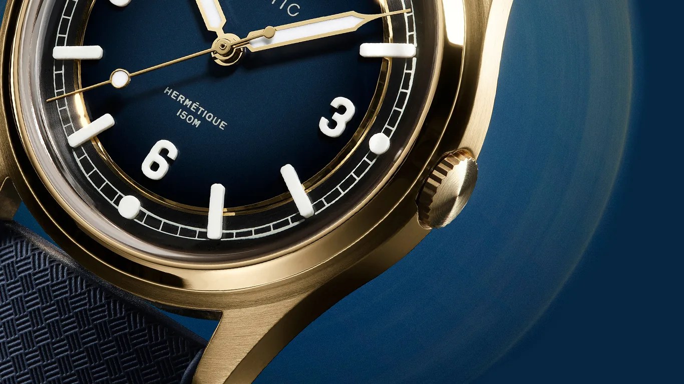 a closeup of a bronze baltic field watch
