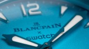 a closeup of a blue blancpain x swatch dive watch dial