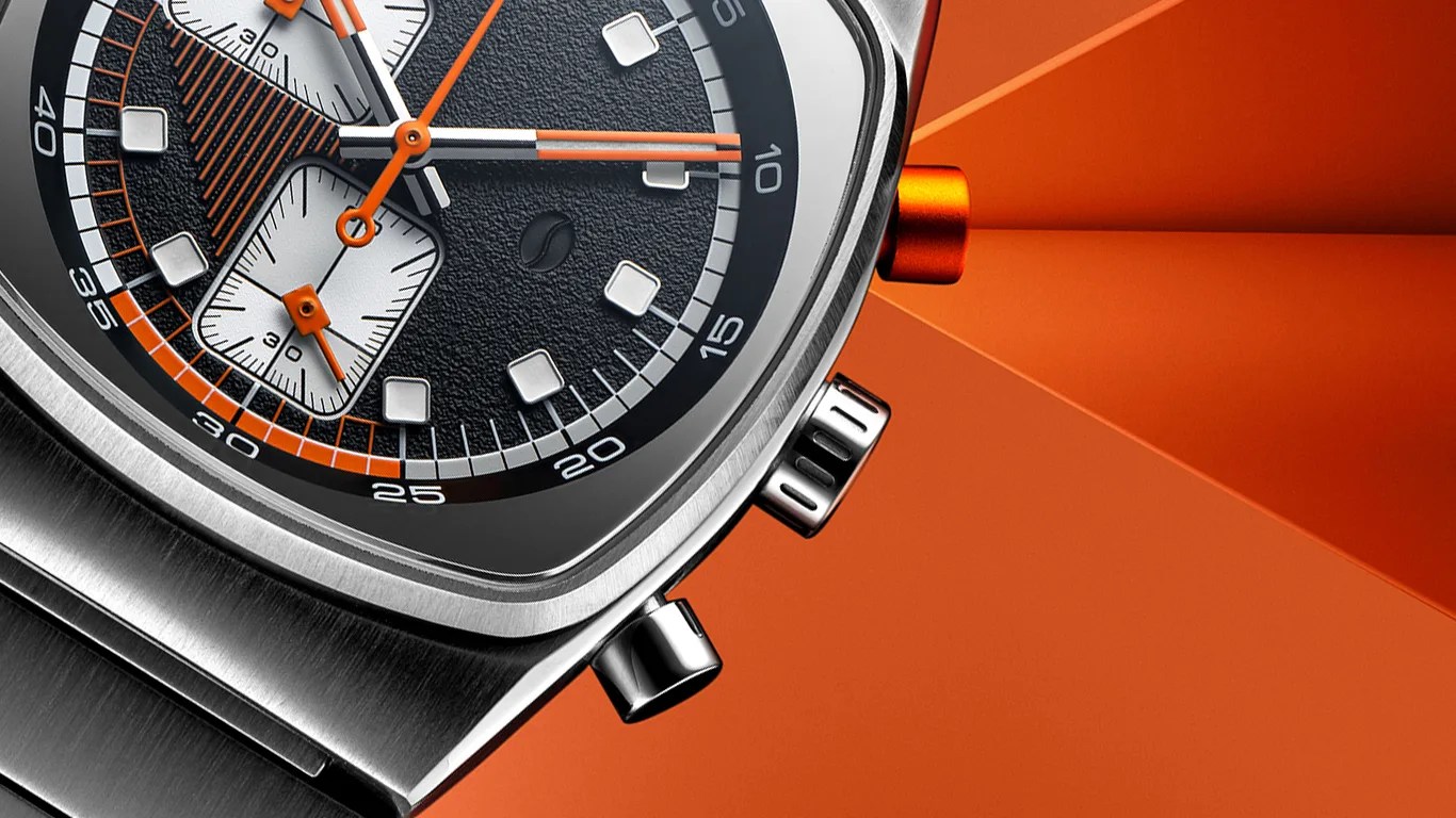 a closeup of a brew chronograph watch against an orange background