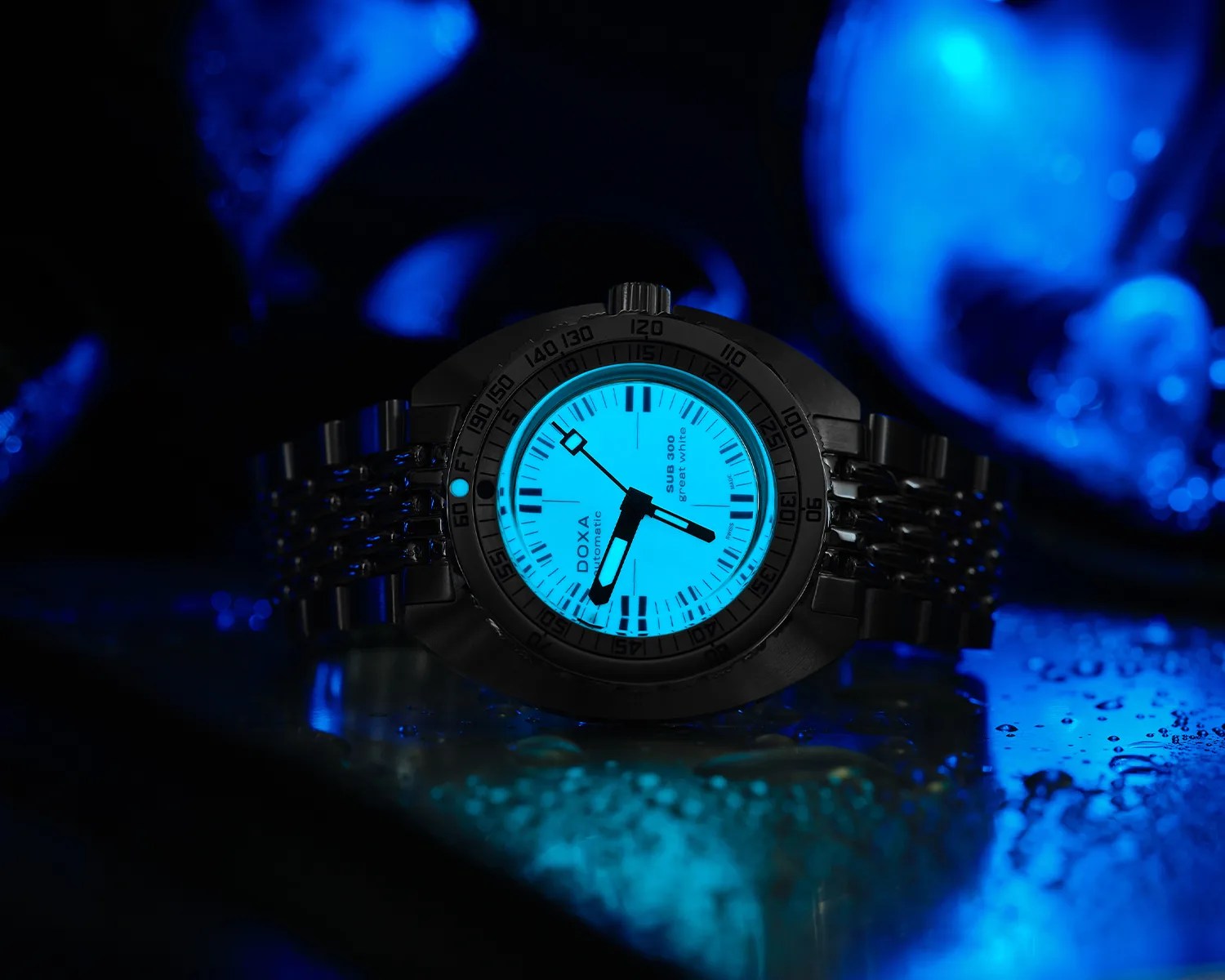 a doxa dive watch with a luminous dial glowing in the dark