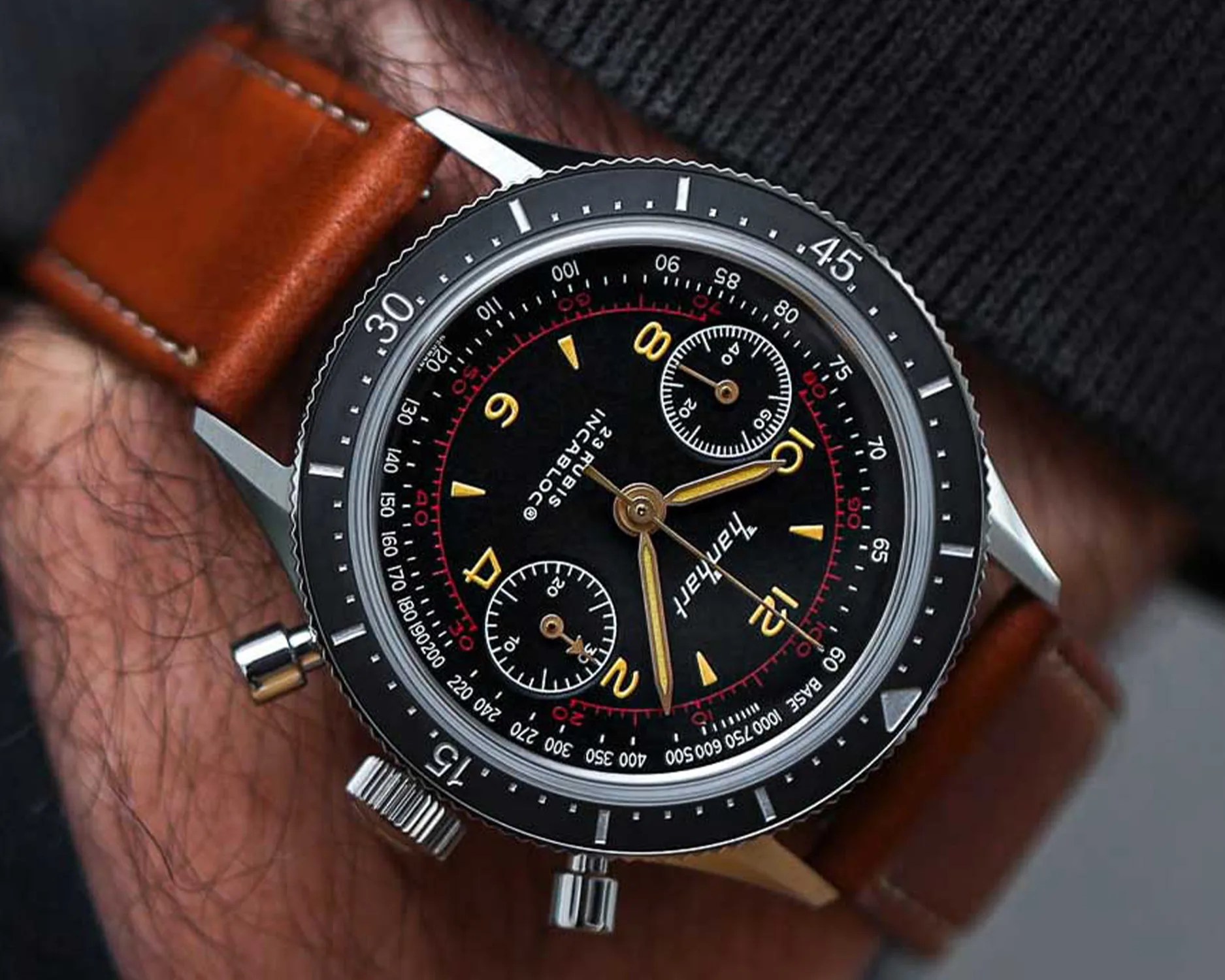 a hanhart chronograph watch on a mans wrist