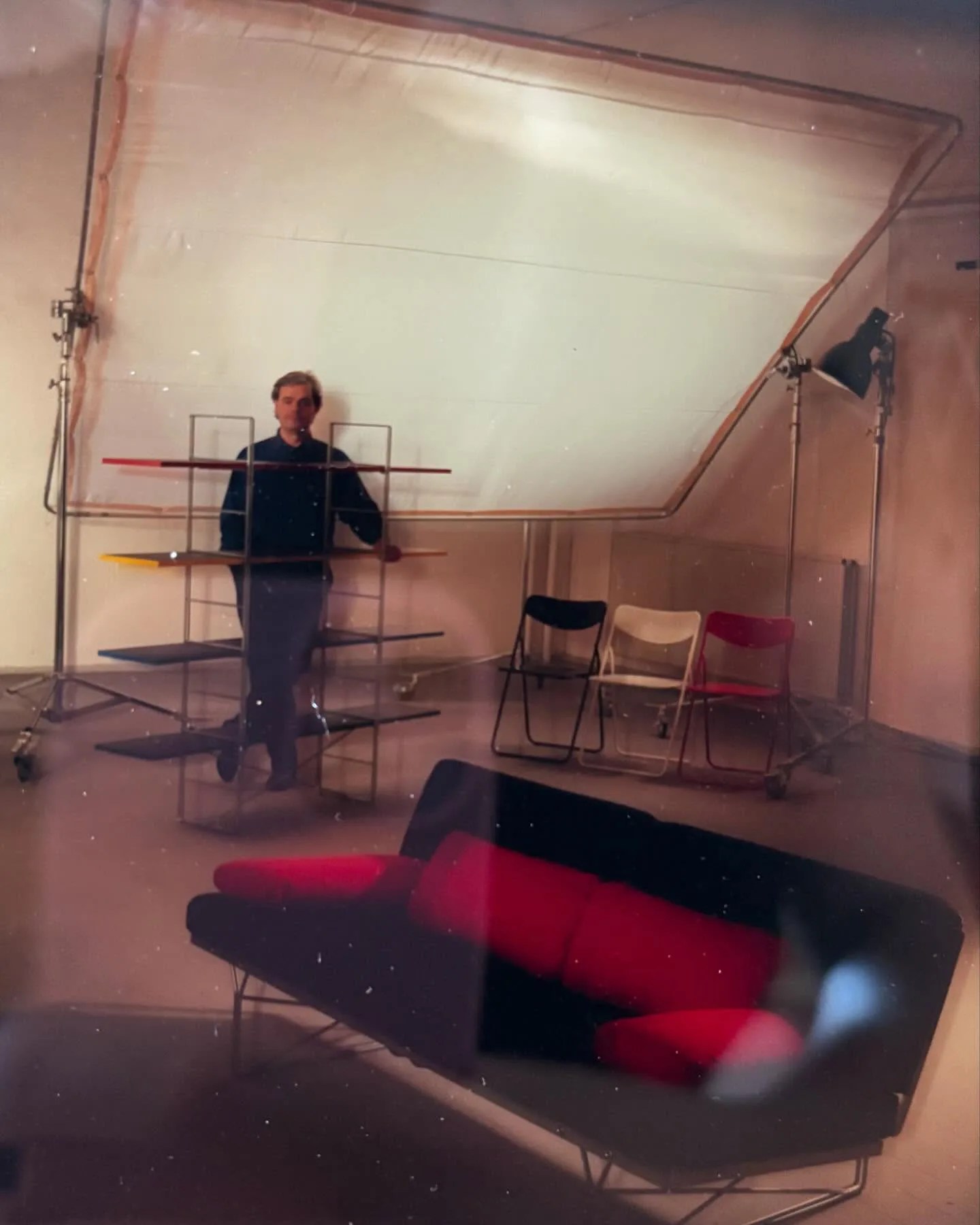 designer Niels Gammelgaard standing with a shelving unit