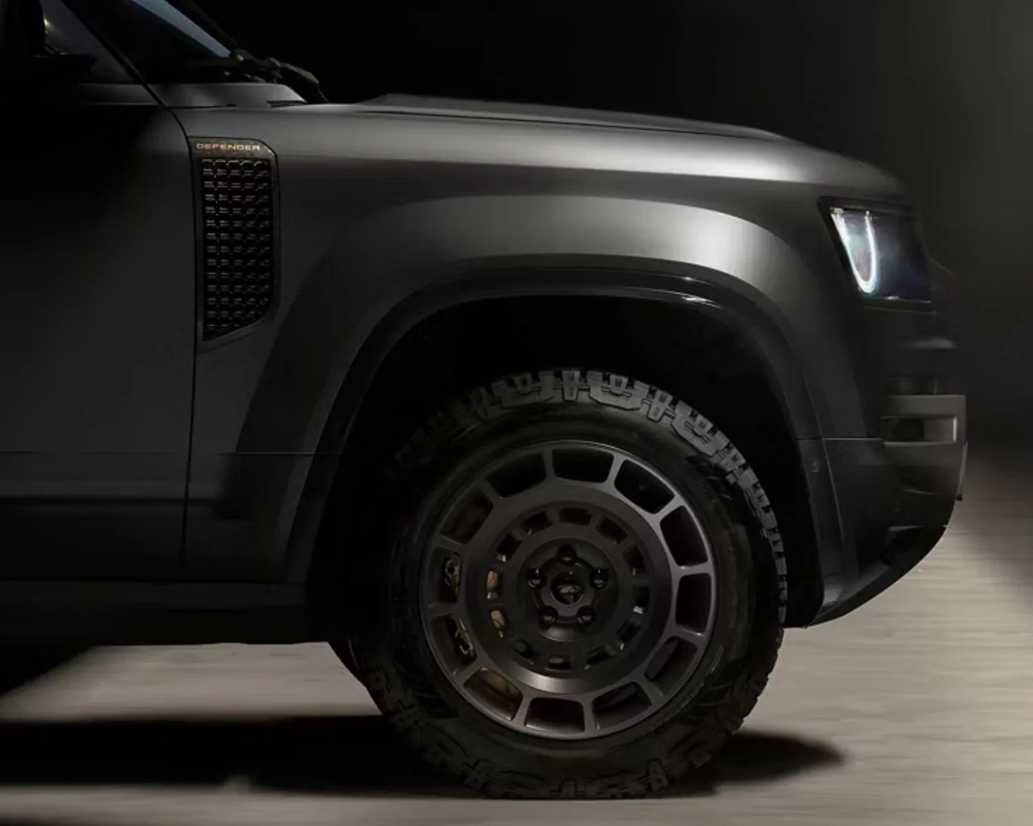 land rover defender octa side