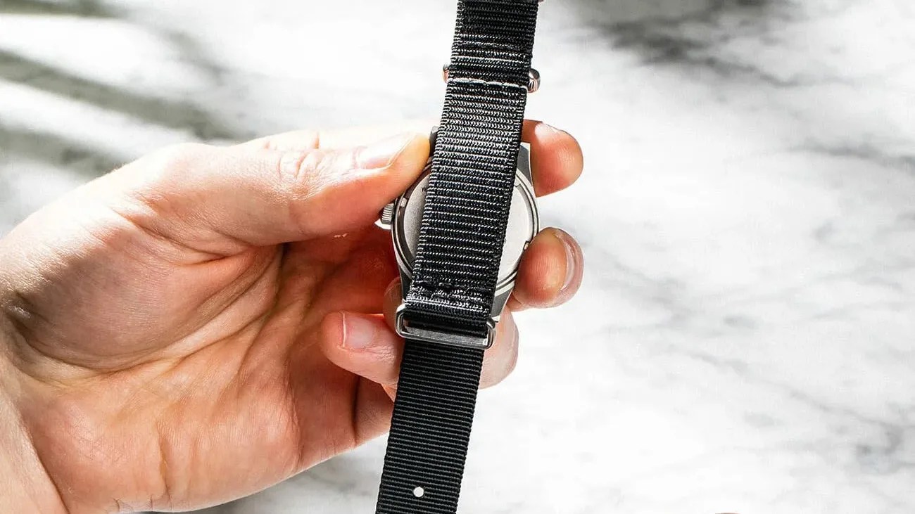 hand holding a watch strap