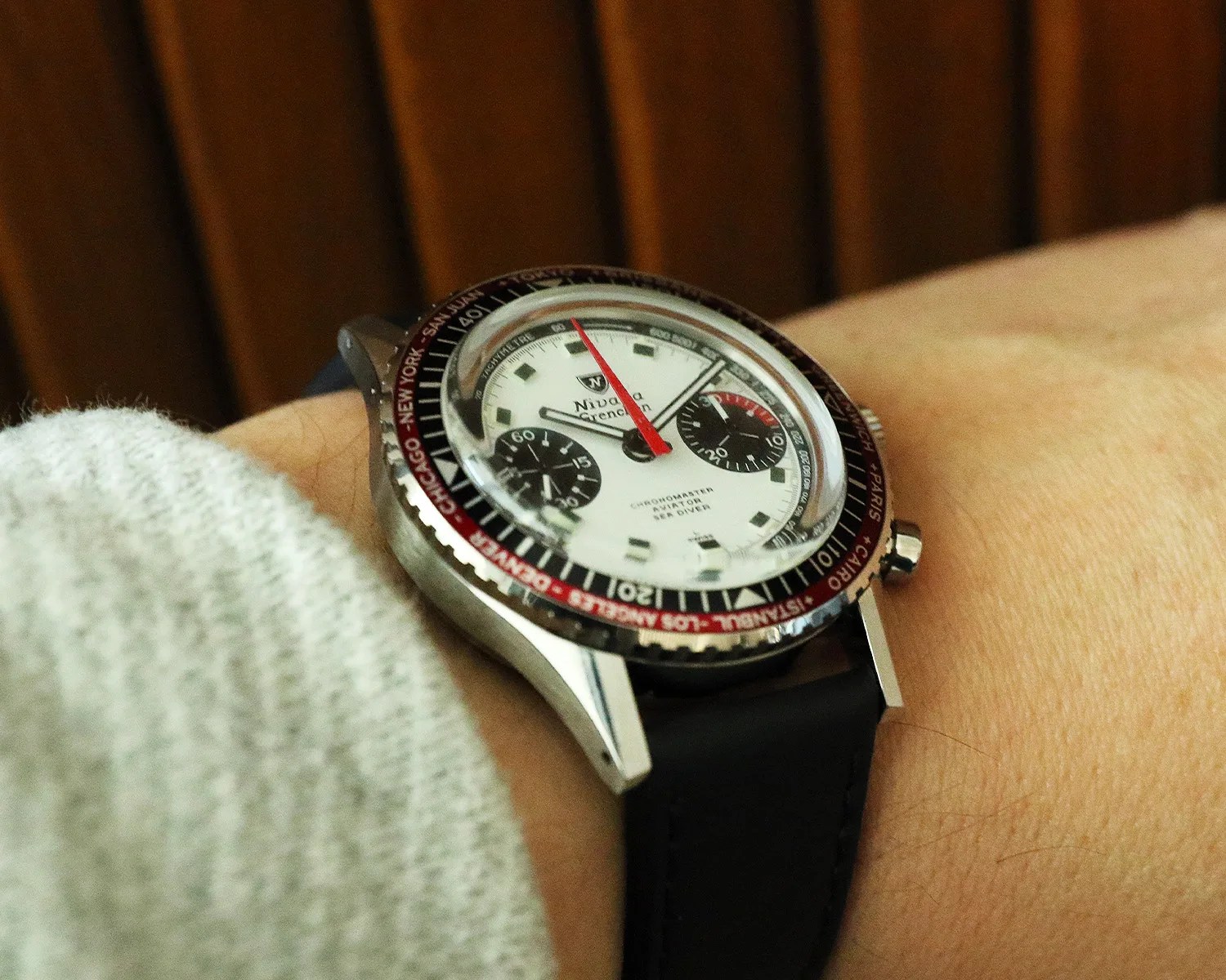 a nivada grenchen chronograph watch on a mans wrist