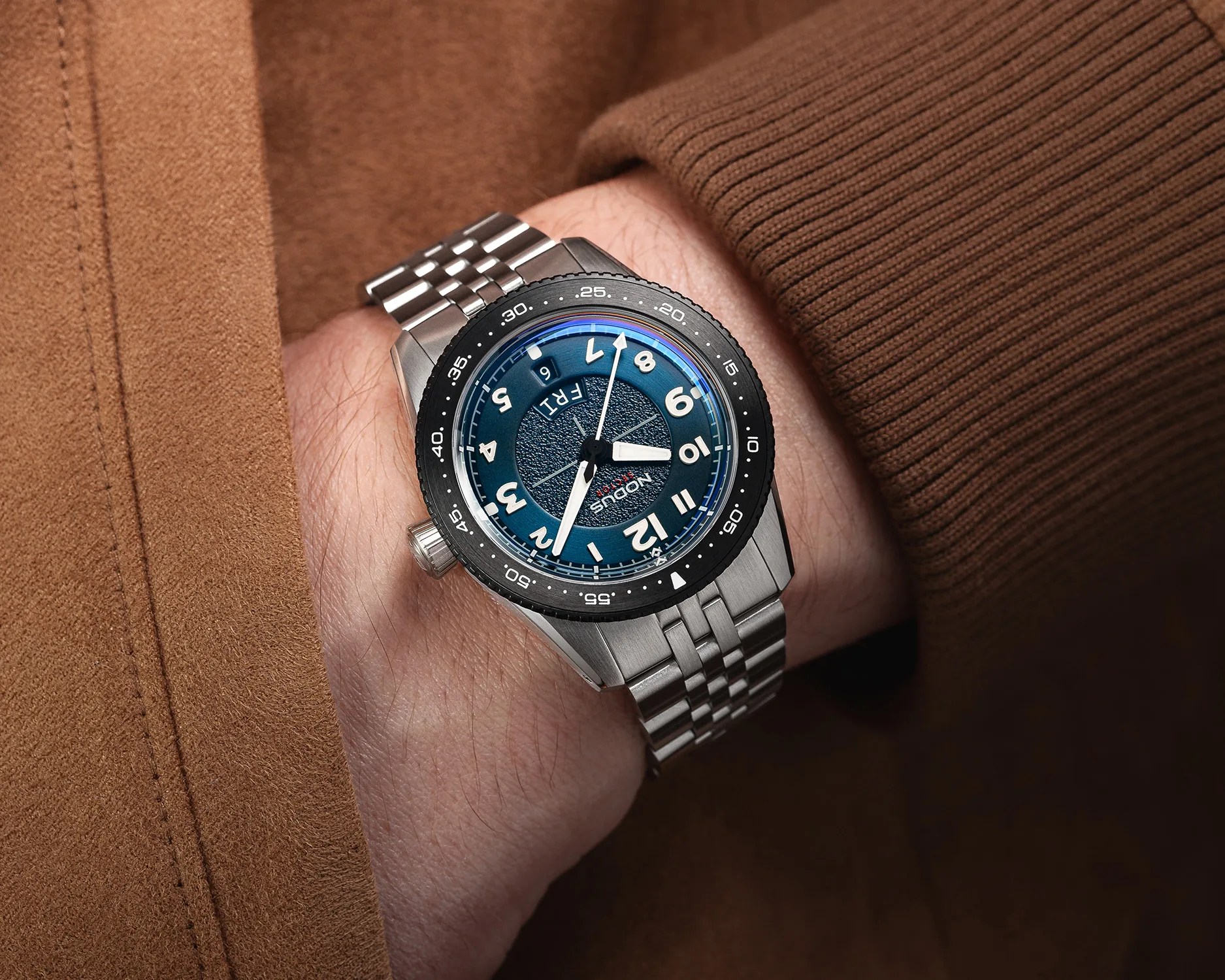 a nodus pilot watch on a mans wrist