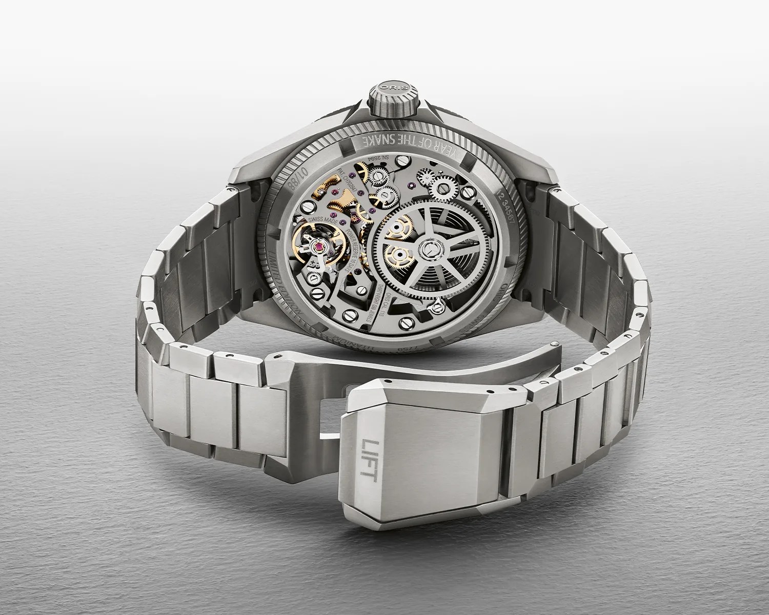 an oris watch seen from the back with its movement visible
