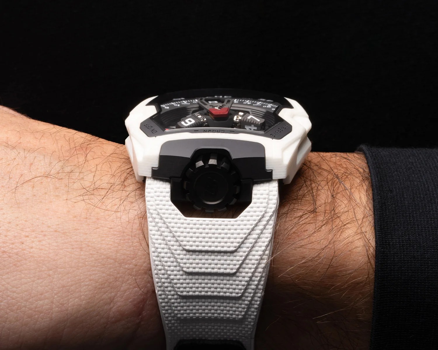 an urwerk ceramic watch on a mans wrist seen from the side