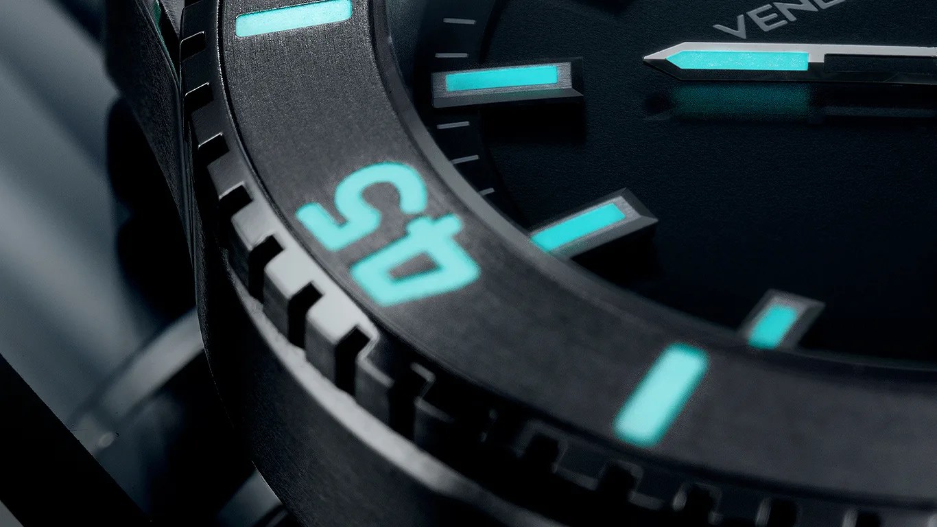 a closeup of a venezianico titanium dive watch bezel