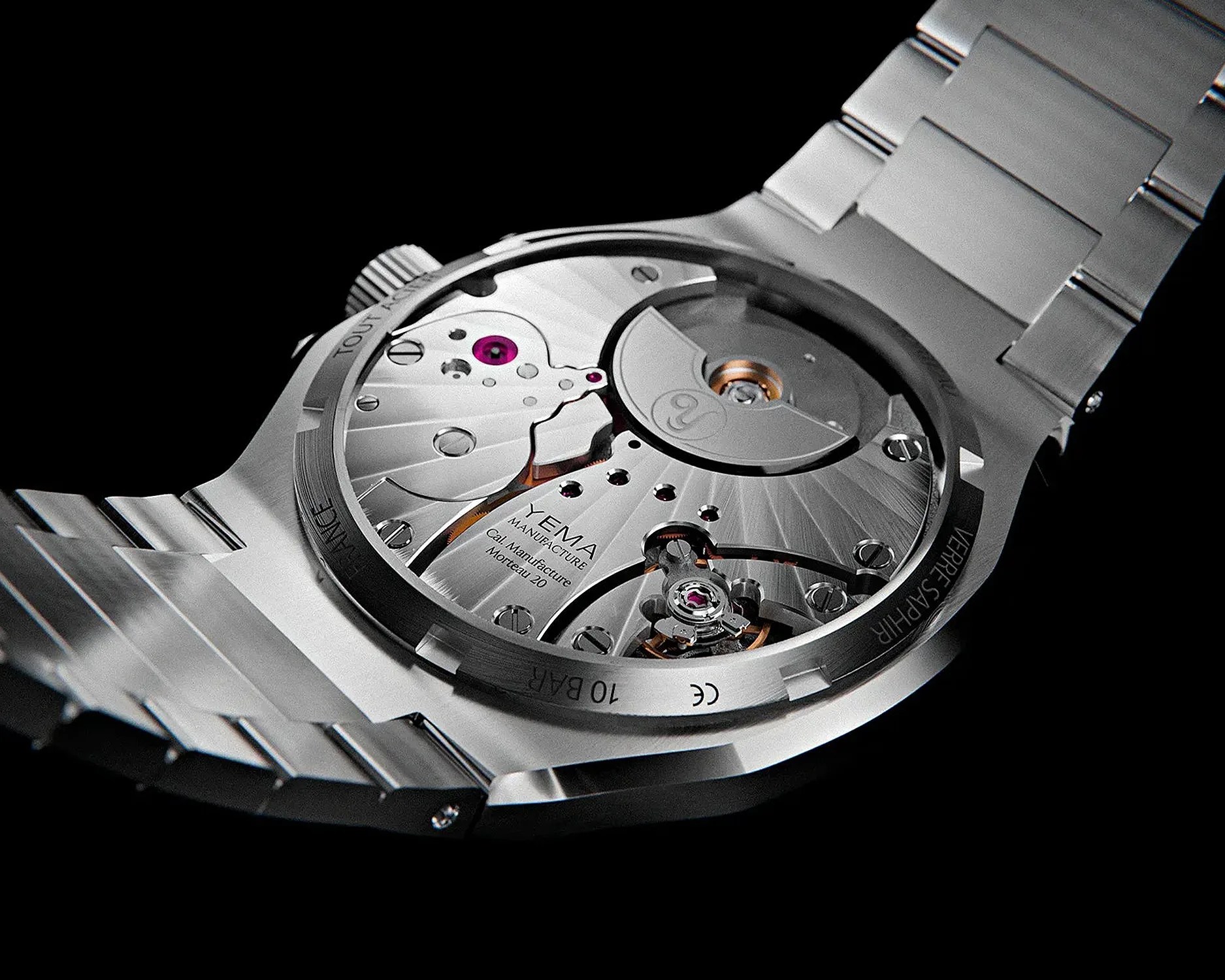 the micro rotor movement on a yema sports watch seen through a display caseback