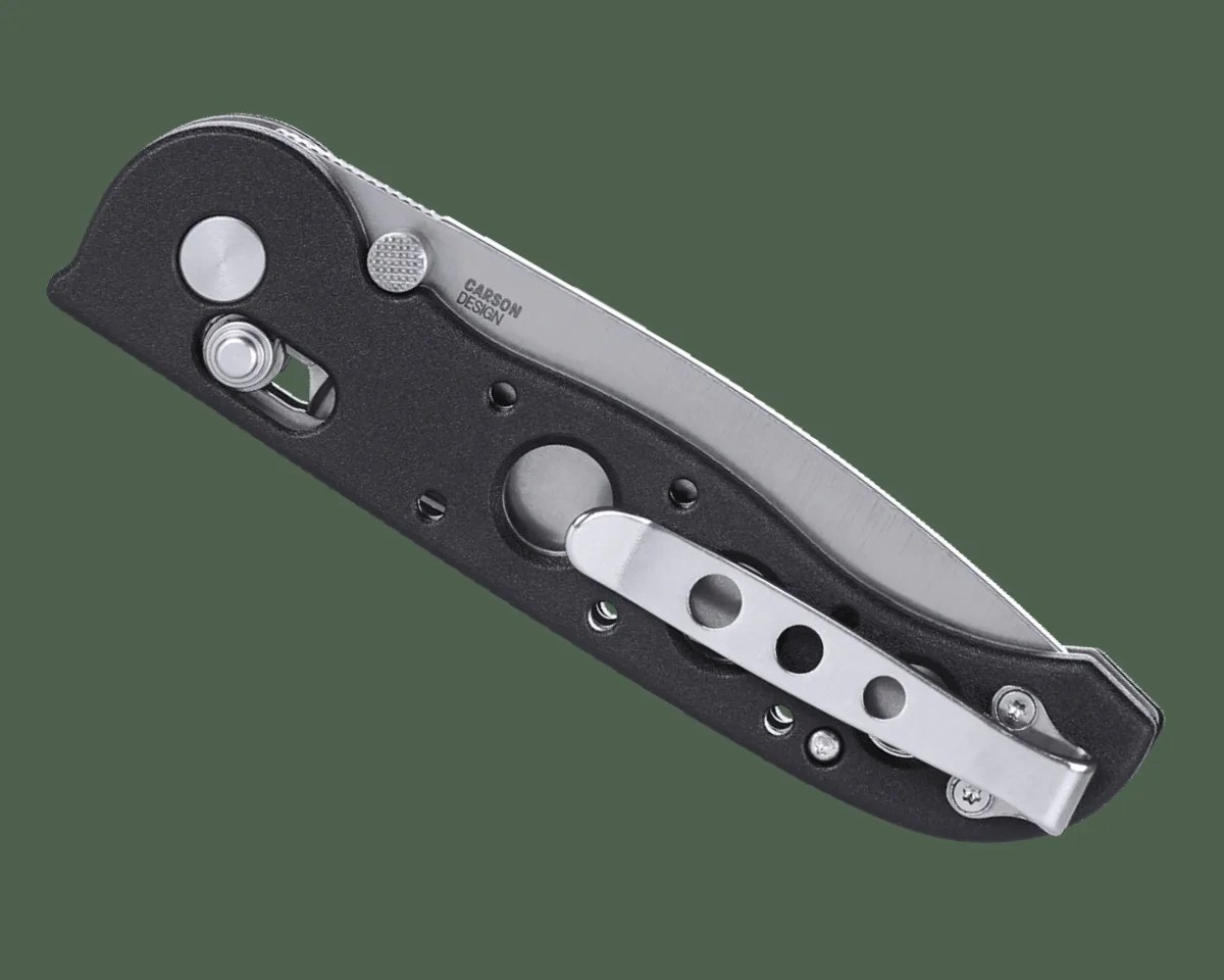 CRKT M16 Crossbar knife folded on green background
