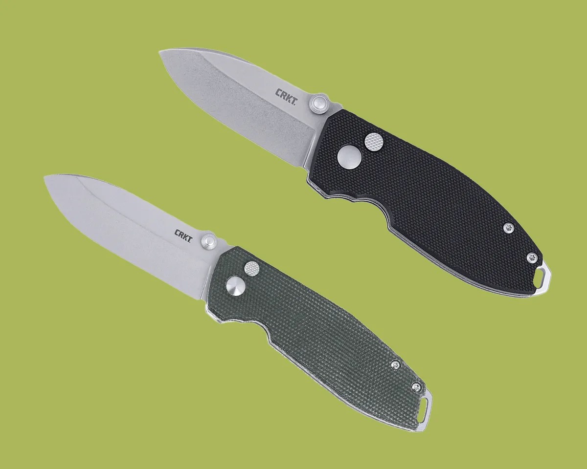 CRKT Squid Button Lock knives on green background