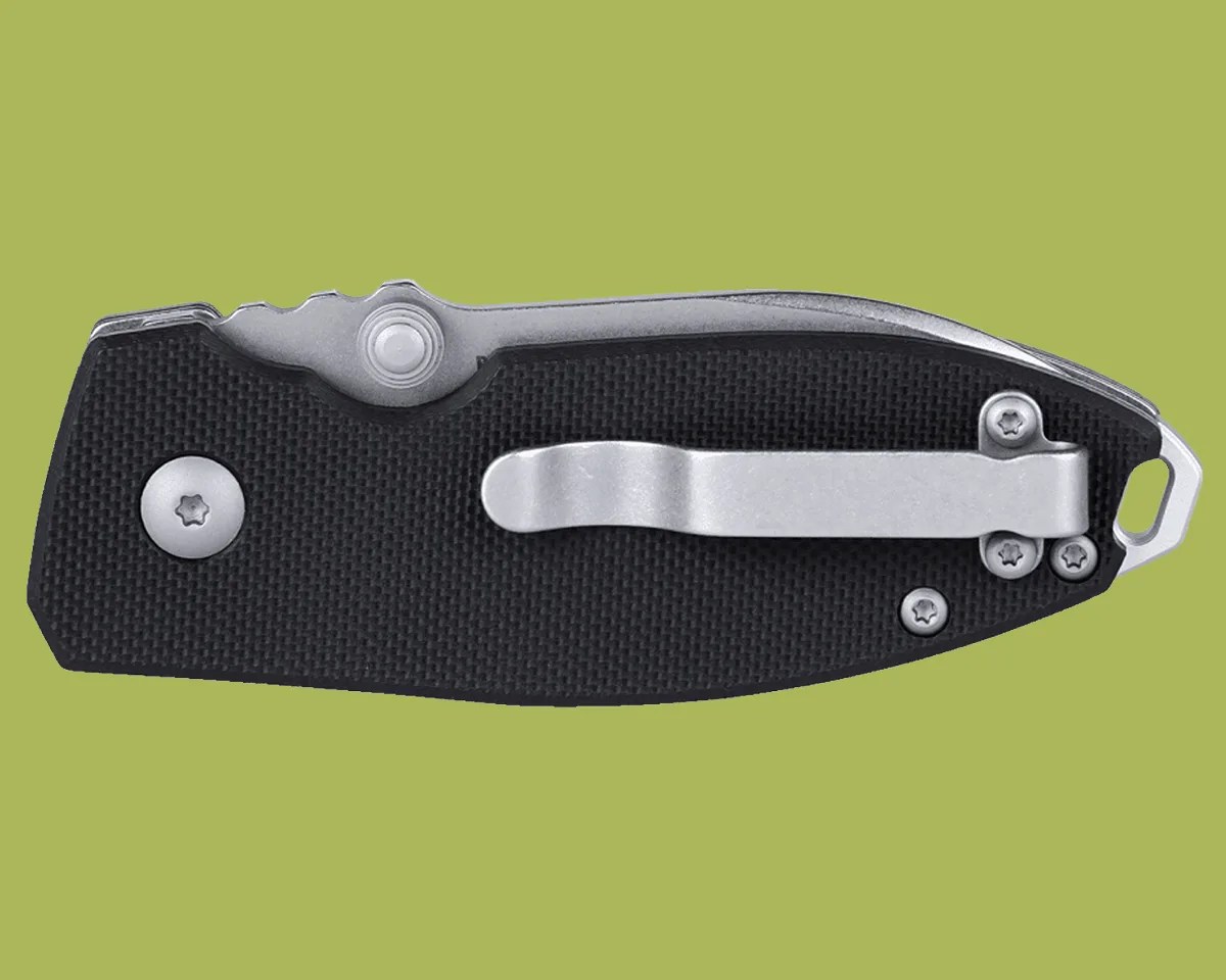 CRKT Squid Button Lock closed on green background