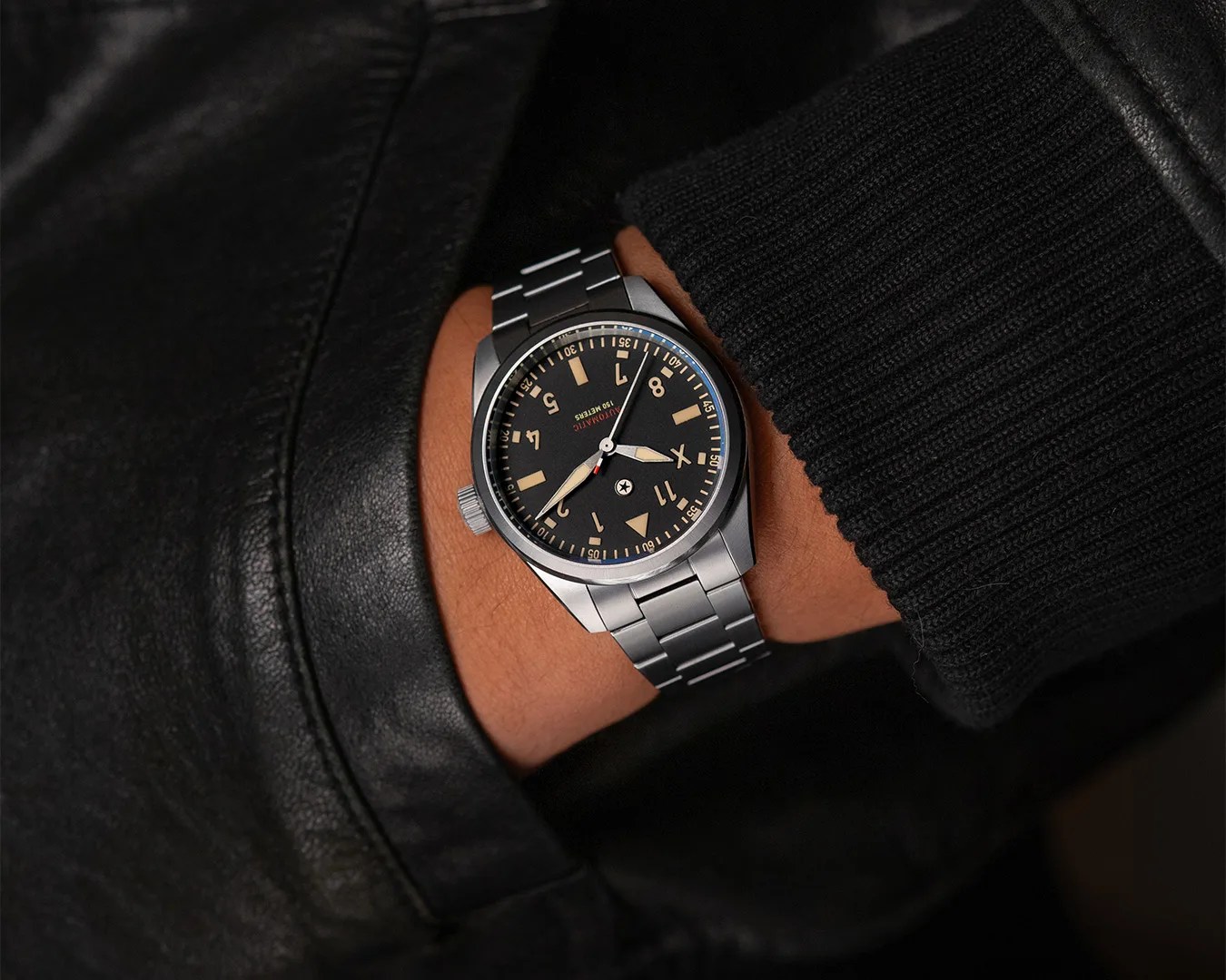 man wearing Jack Mason 10 Year Anniversary Pursuit Pilot watch