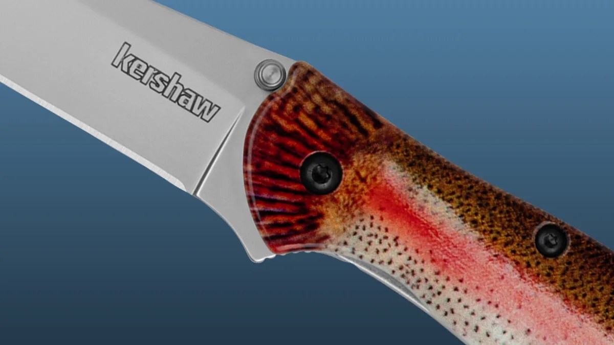 Closeup of Kershaw Leek Rainbow Trout knife on blue background