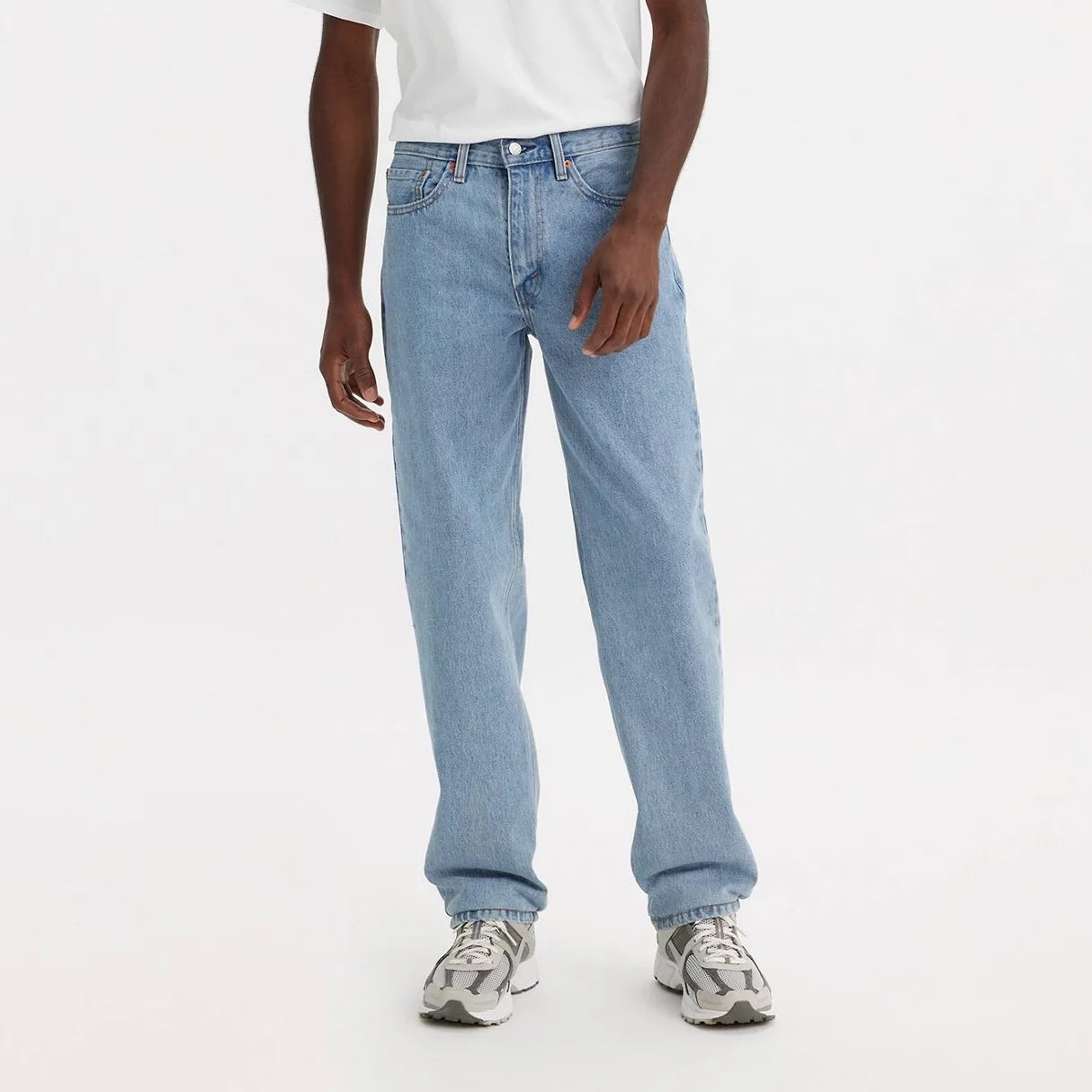 A man in jeans, from the waist down.