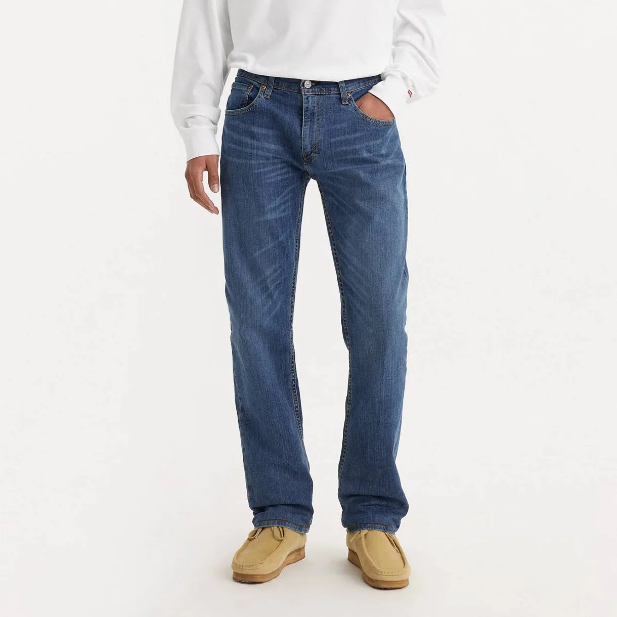 A man in jeans, from the waist down.