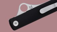 Closeup of Spyderco Essenza on pink background
