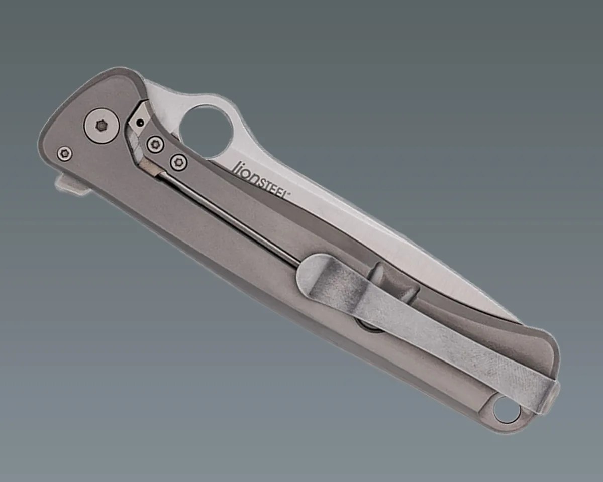 Spyderco Slym knife closed on gray gradient background