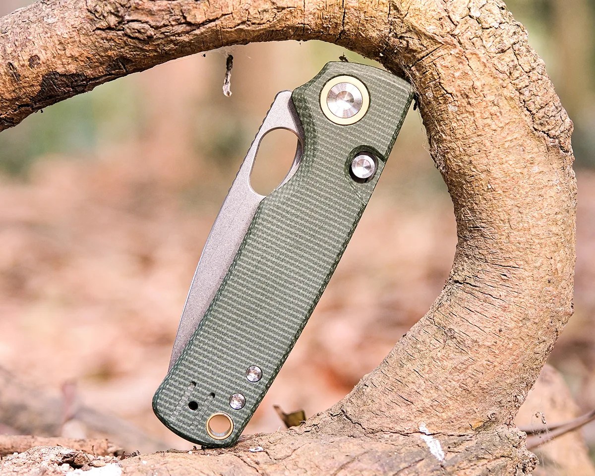 Vosteed Porcupine knife folded and sitting on tree root