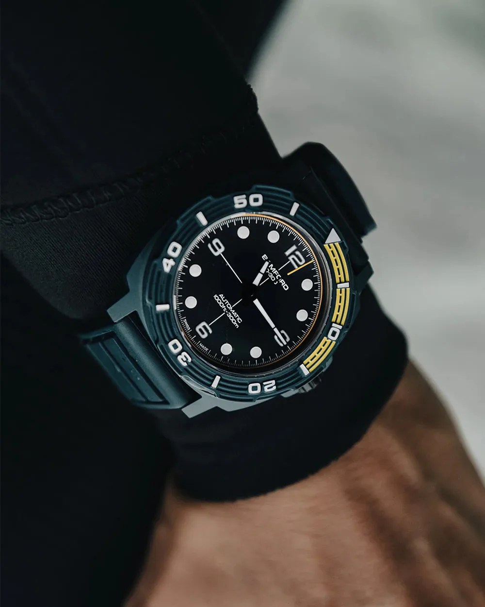 a dive watch on a man's wrist