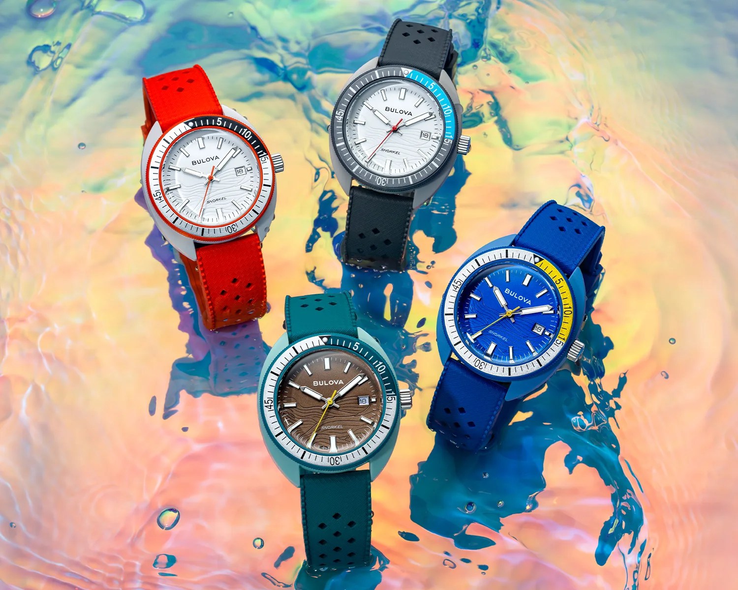 four bulova dive watches on water
