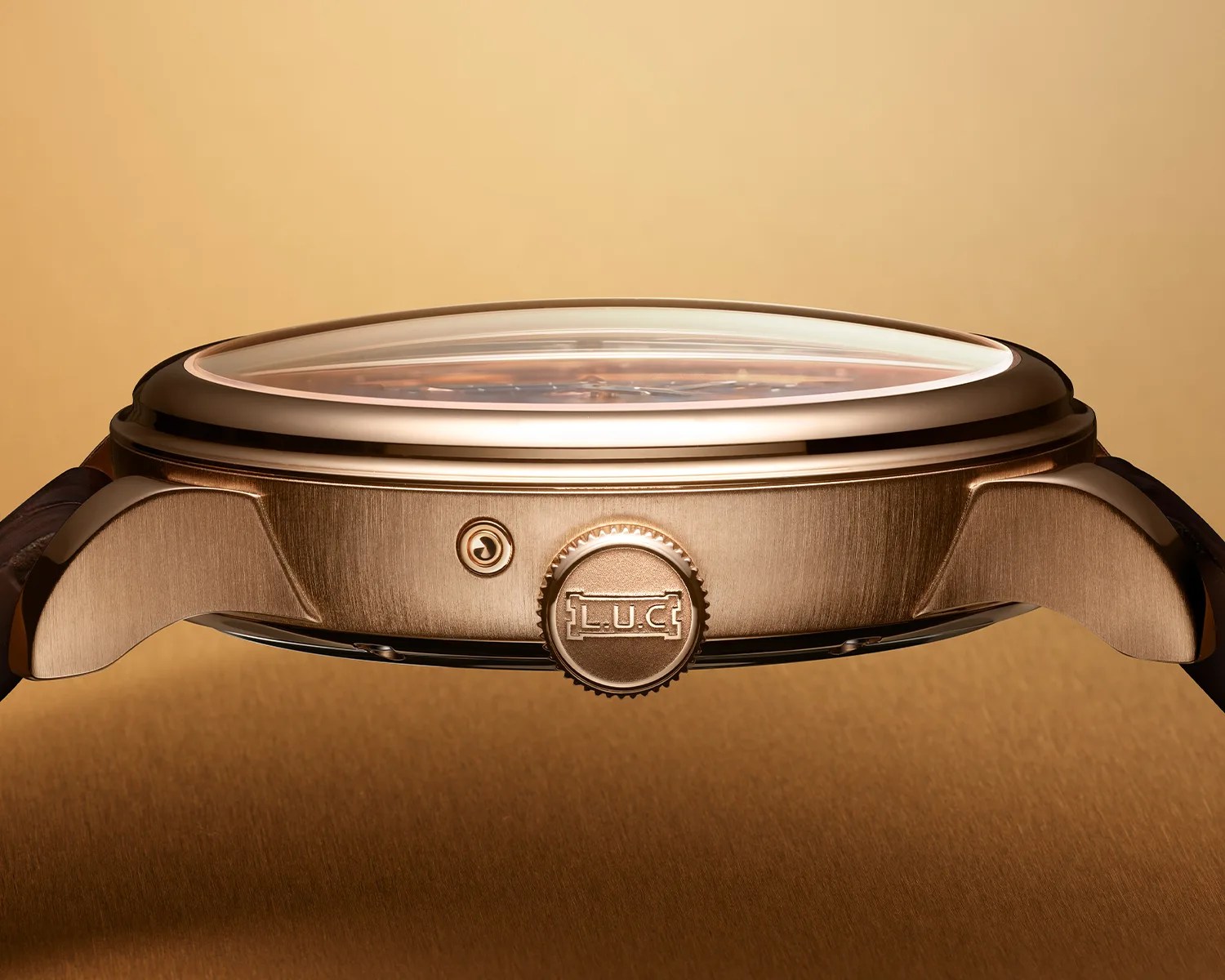 a gold chopard dress watch viewed from the side