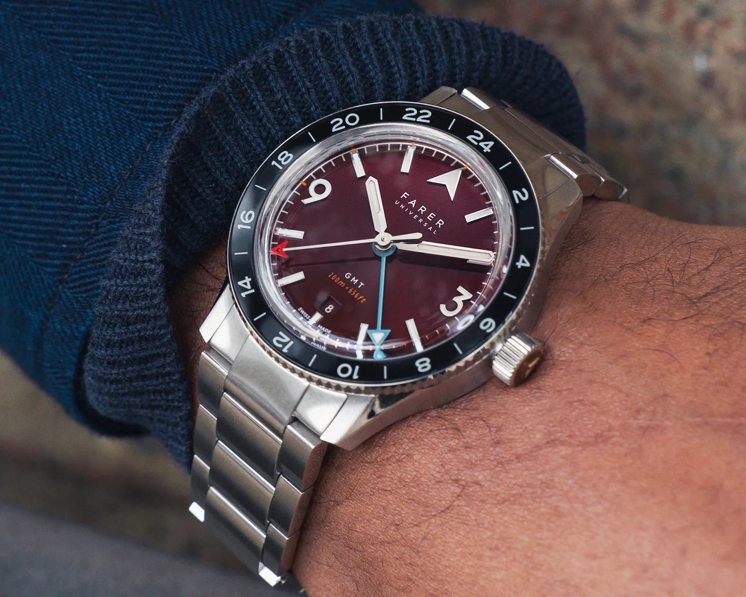 a farer gmt watch on a mans wrist