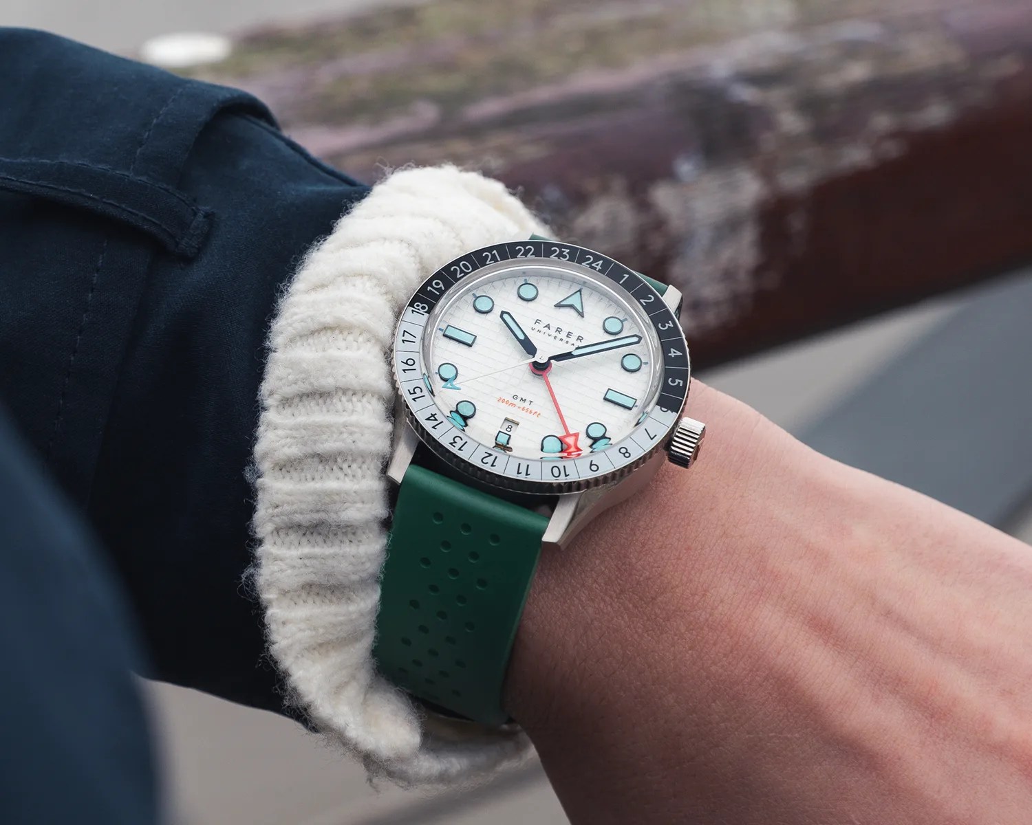 a farer gmt watch on a mans wrist