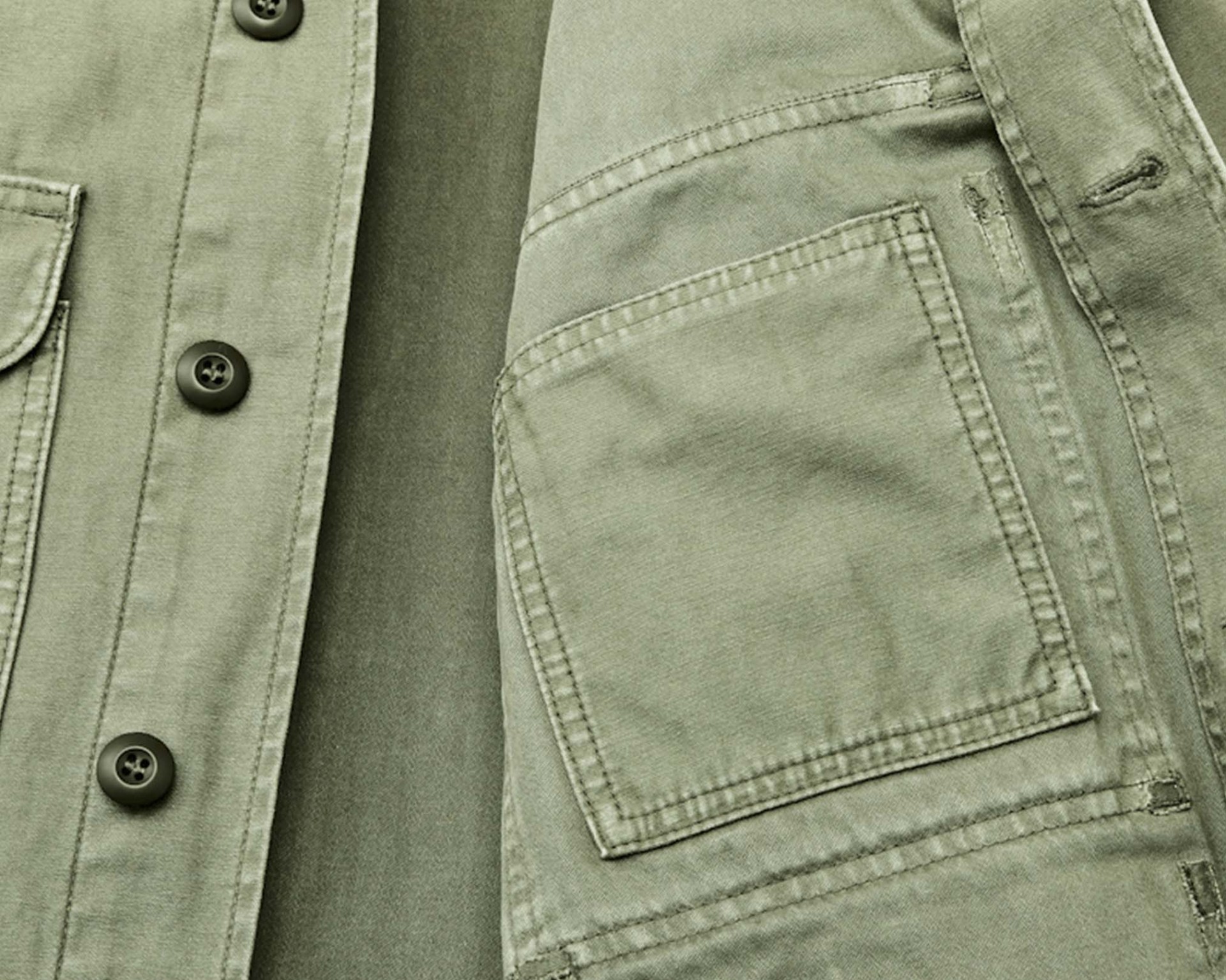 the inside pokcet of a green canvas jacket