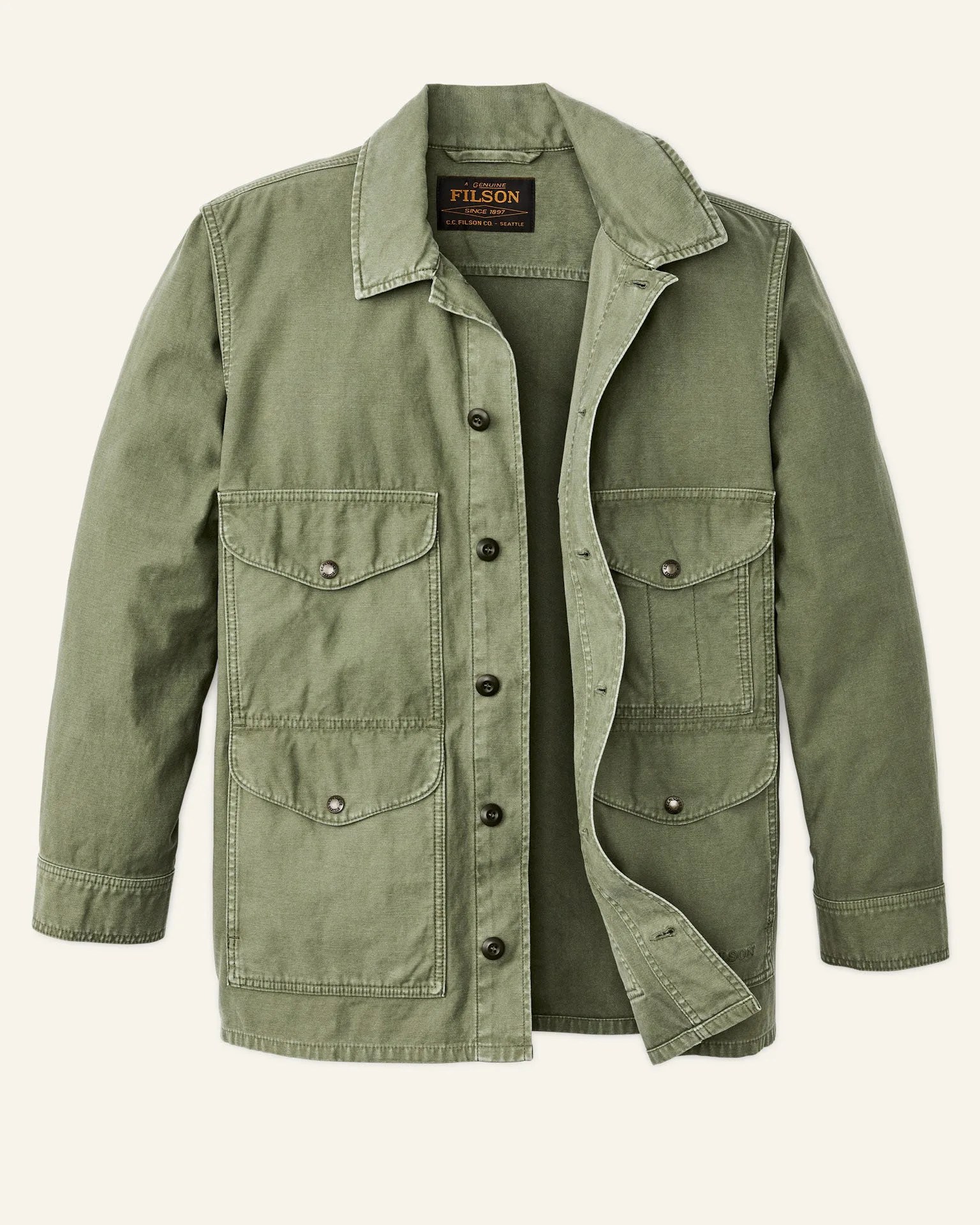 A green Filson filed cruiser jacket