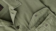 the open chest pocket and collar of a green Filson Field Cruiser Jacket