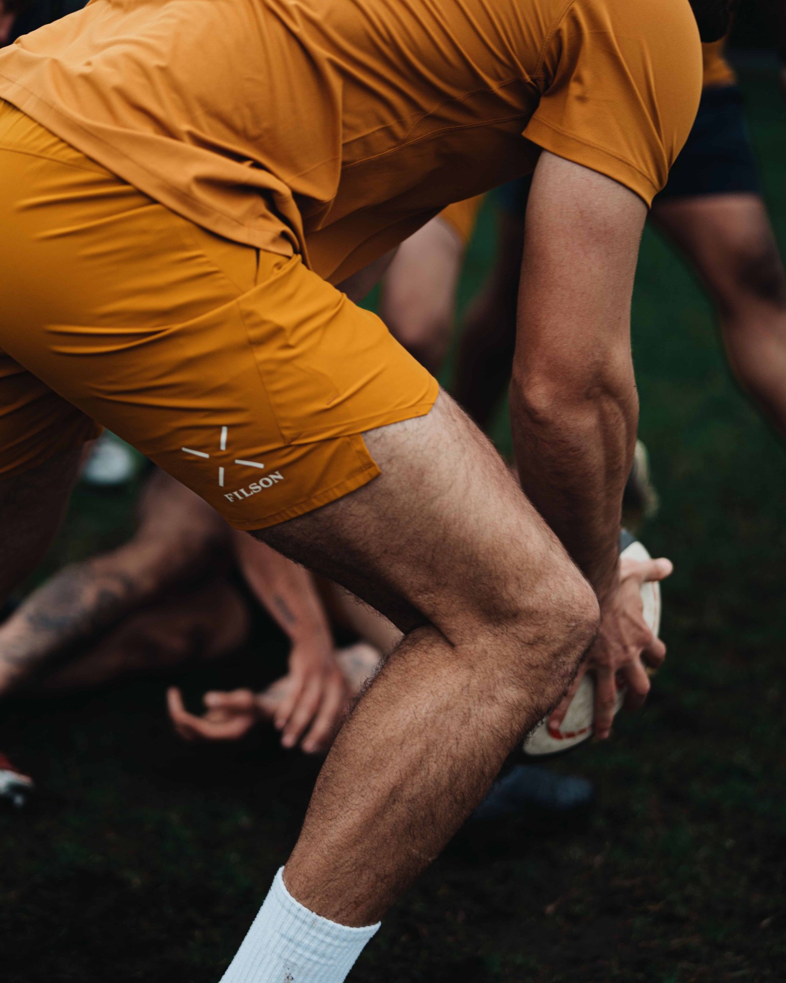 rugby player in yellow shorts
