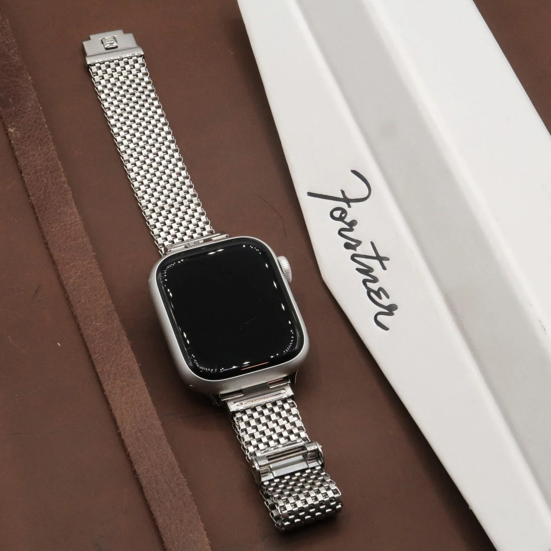 an apple watch on a forstner bracelet